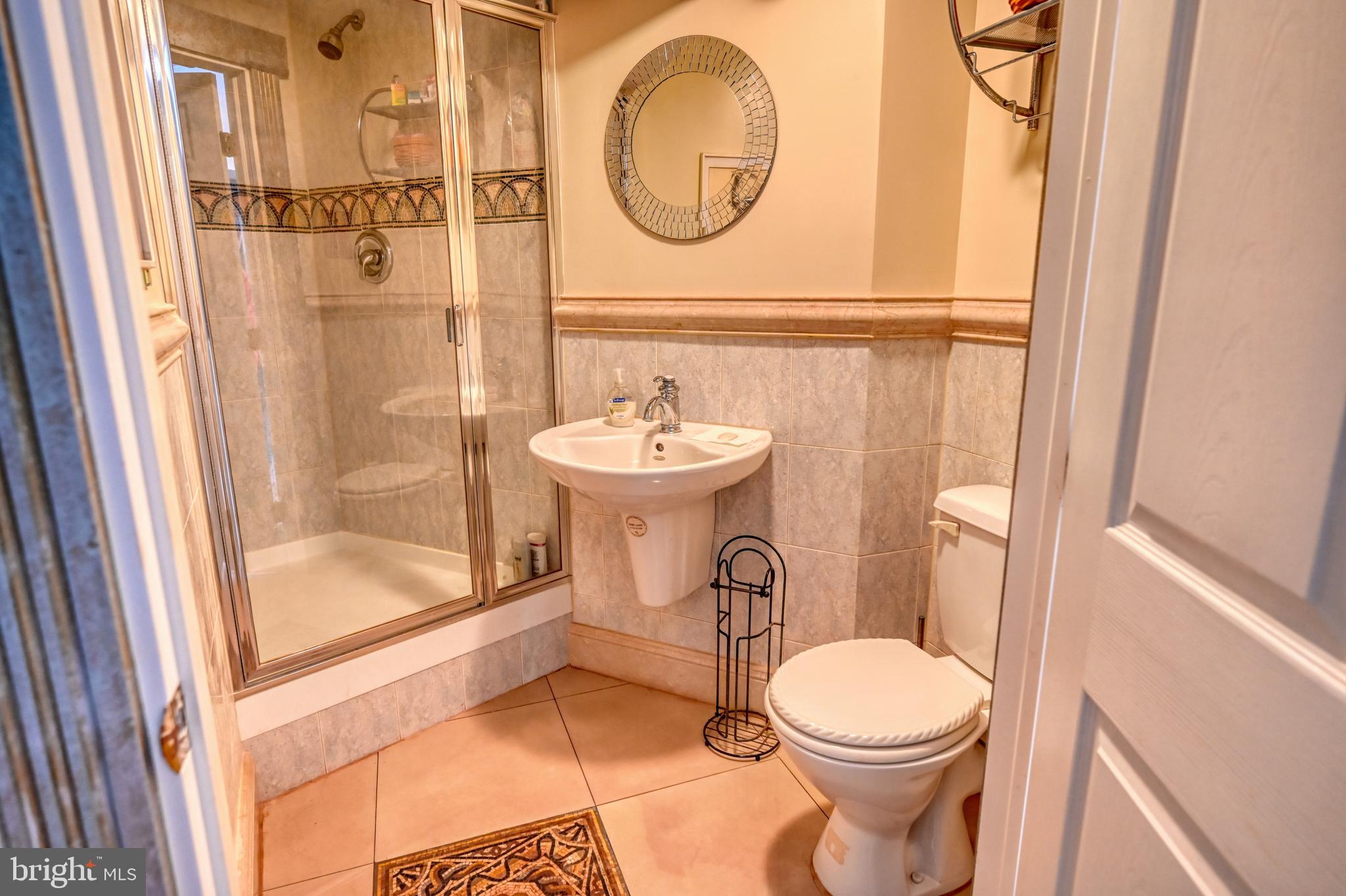253 Quaker City Road Kempton, PA 19529 - Photo 35 of 61 a bathroom with a sink a toilet and a mirror