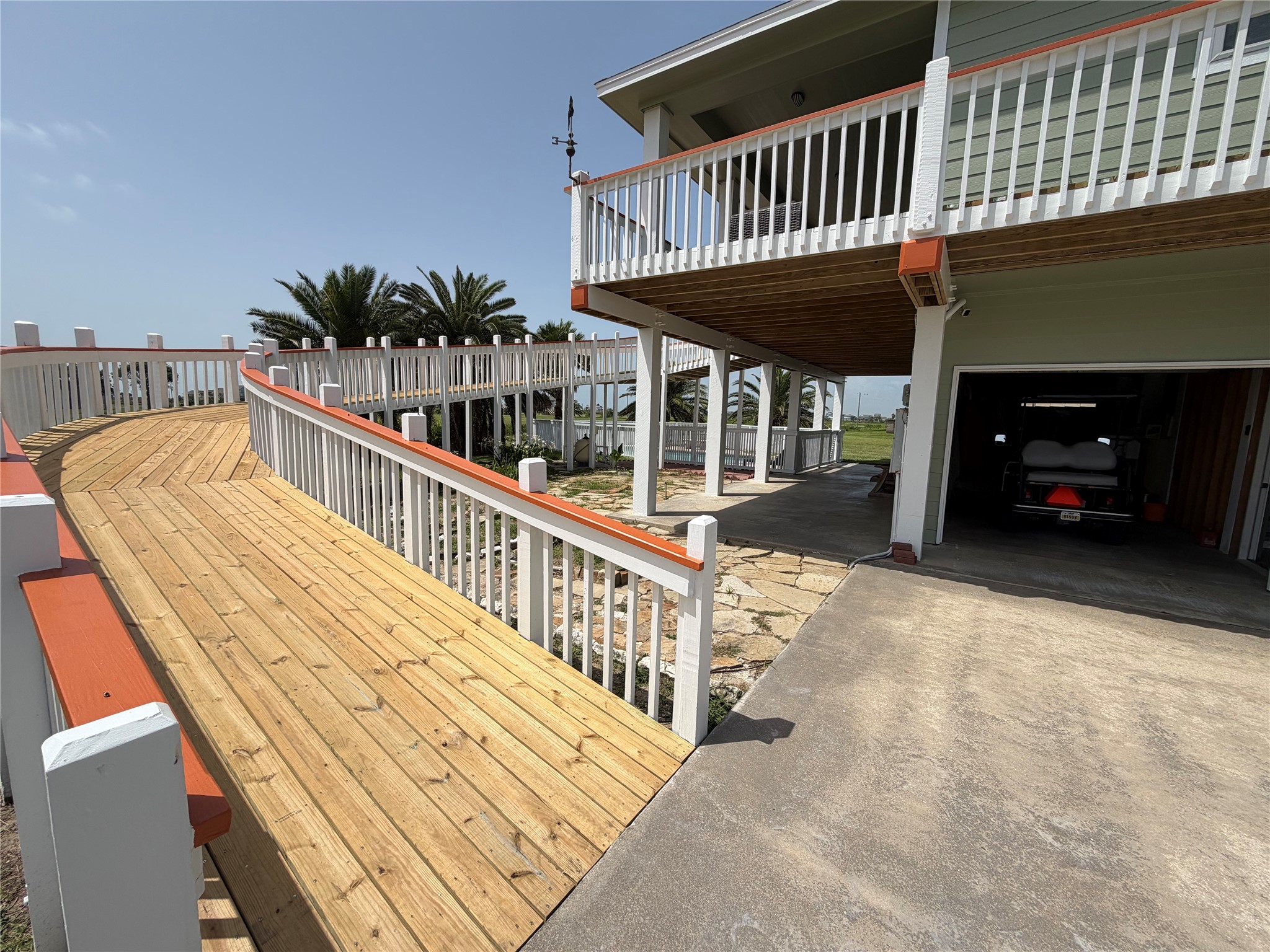 979 Rancho Carribe Drive Crystal Beach, TX 77650 - Photo 15 of 50 Walking or Golf Cart ramp to the front deck