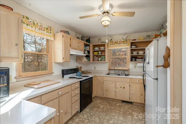a kitchen with stainless steel appliances granite countertop a stove and a sink
