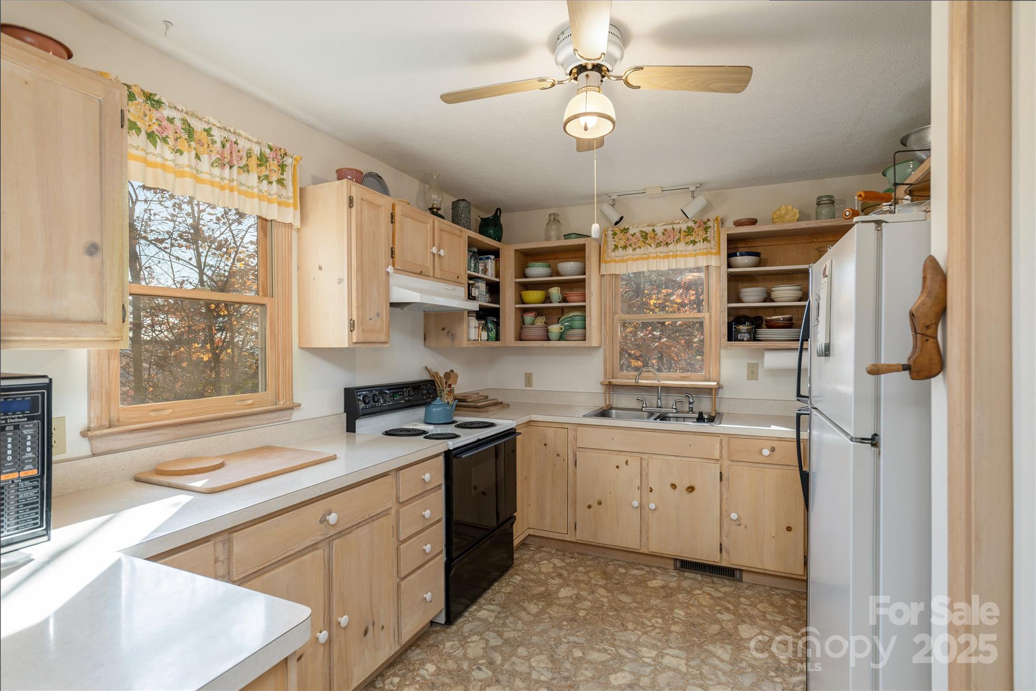2355 Round Mountain Road Brevard, NC 28712 - Photo 11 of 27 a kitchen with stainless steel appliances granite countertop a stove and a sink