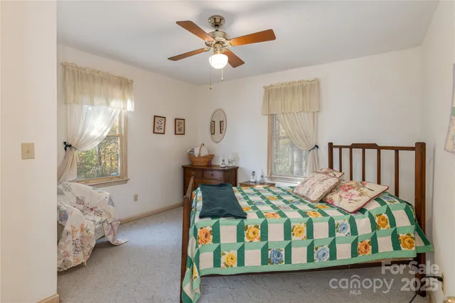 a bedroom with furniture and a window