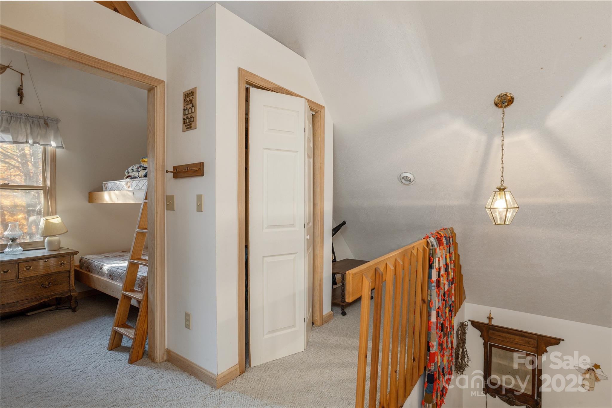 2355 Round Mountain Road Brevard, NC 28712 - Photo 16 of 27 a view of a bedroom with a bed and a window