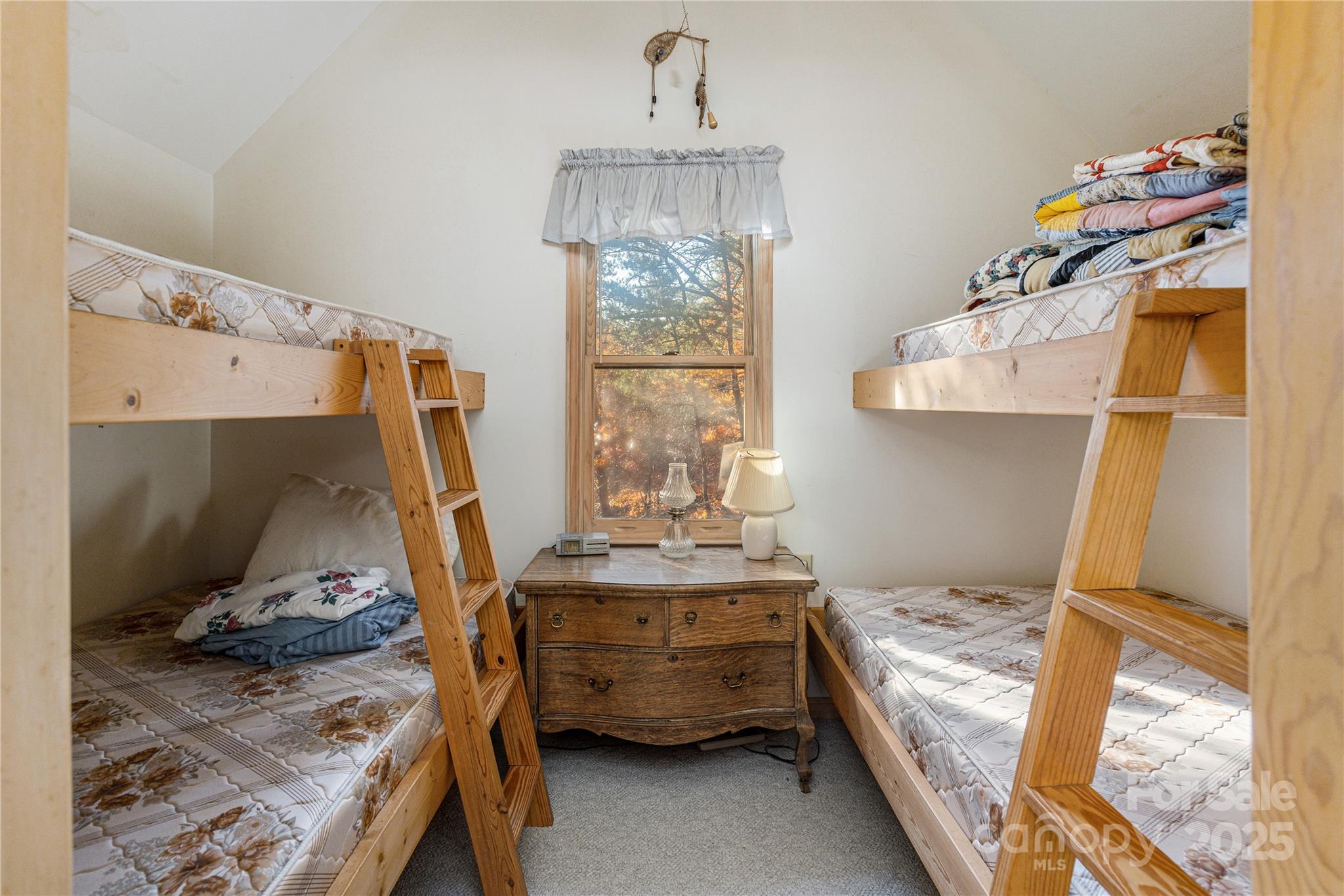 2355 Round Mountain Road Brevard, NC 28712 - Photo 17 of 27 a bedroom with a bed and a window