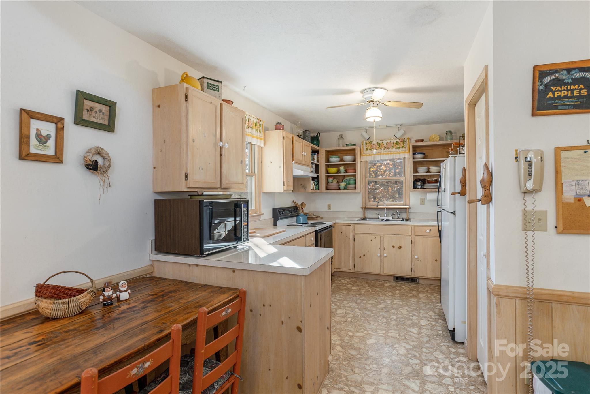 2355 Round Mountain Road Brevard, NC 28712 - Photo 10 of 27 a kitchen that has a lot of cabinets and wooden floor