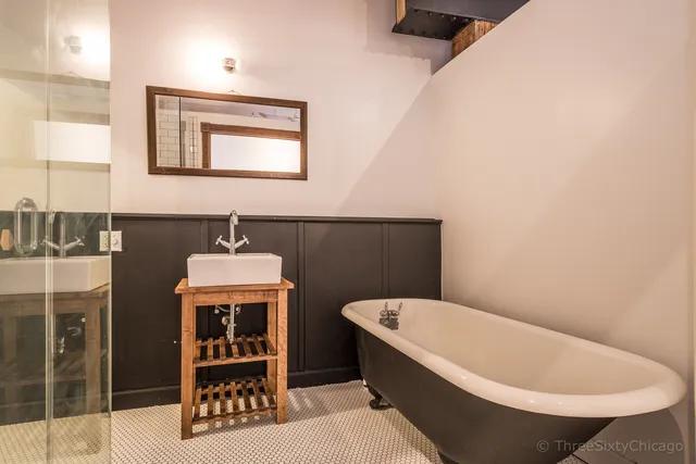 a bathroom with a bathtub and a sink