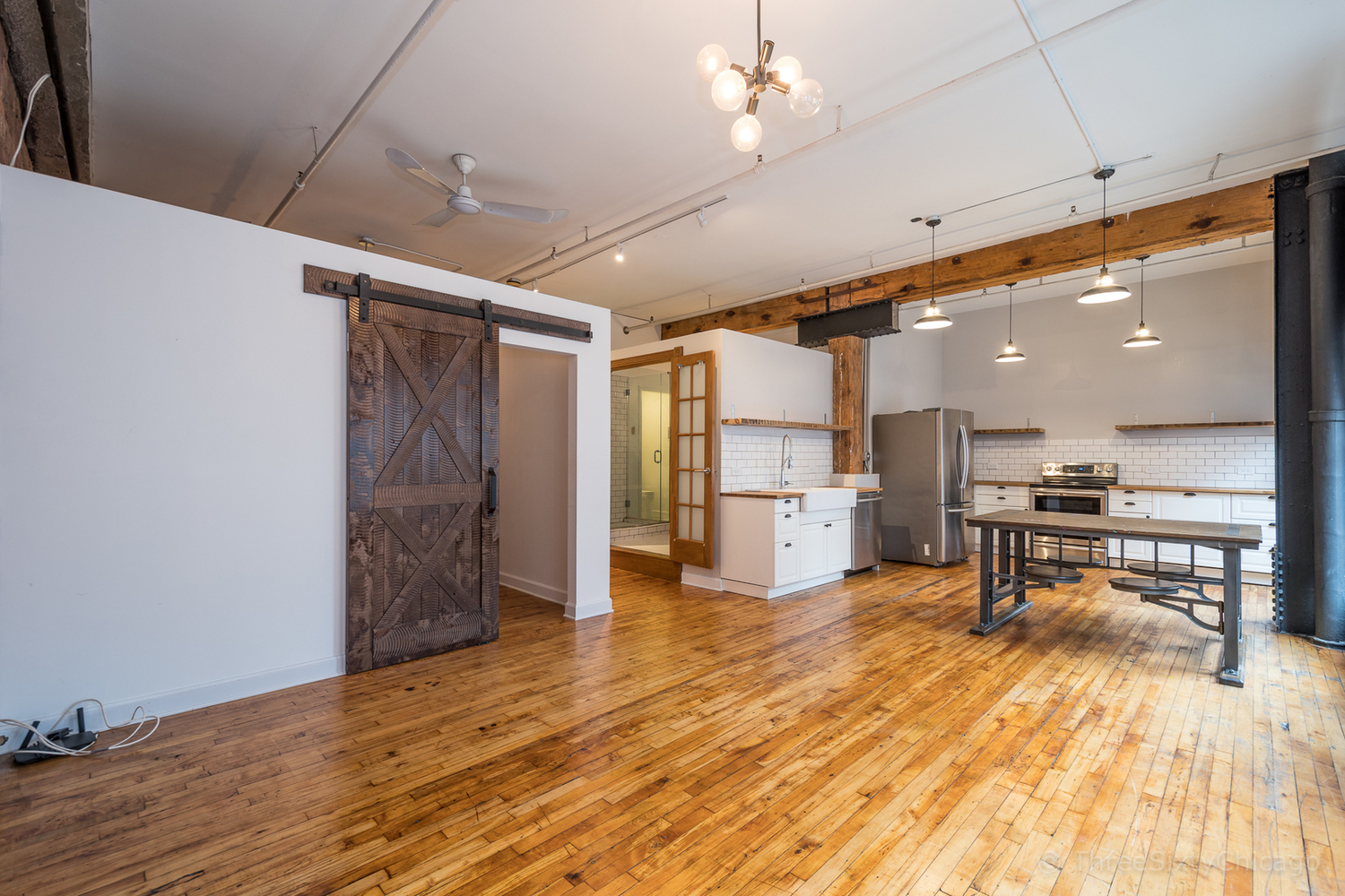 711 South Dearborn Street, Unit 508 Chicago, IL 60605 - Photo 7 of 16 a view of a room with wooden floor and a kitchen