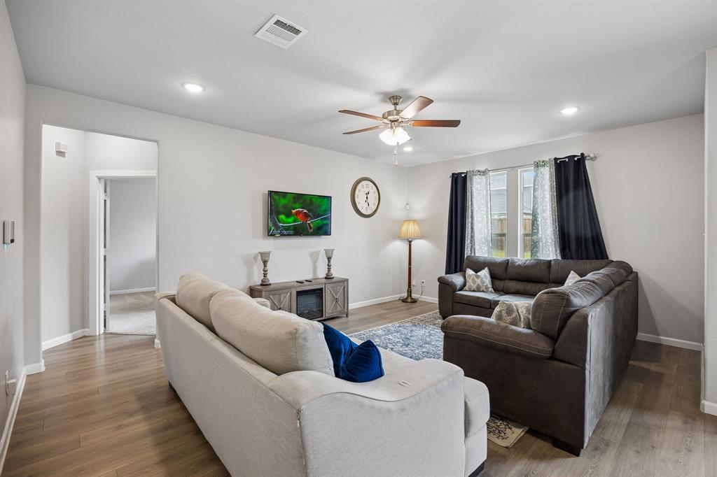 638 Hazeltine Road Red Oak, TX 75154 - Photo 15 of 29 a living room with furniture and a large window
