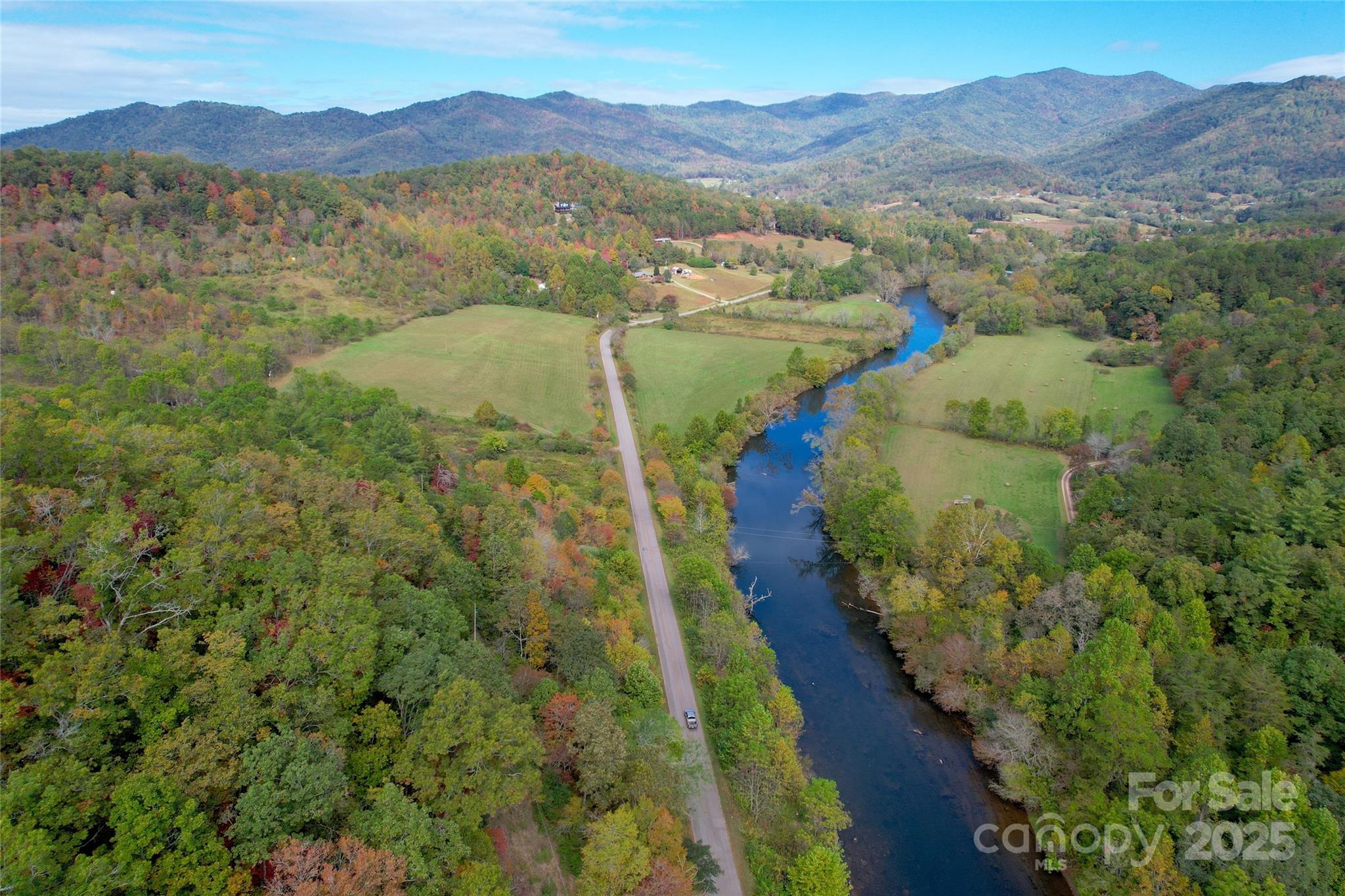 4136 Rose Creek Road Franklin, NC 28734 - Photo 11 of 37 a view of a lake with mountains in the background