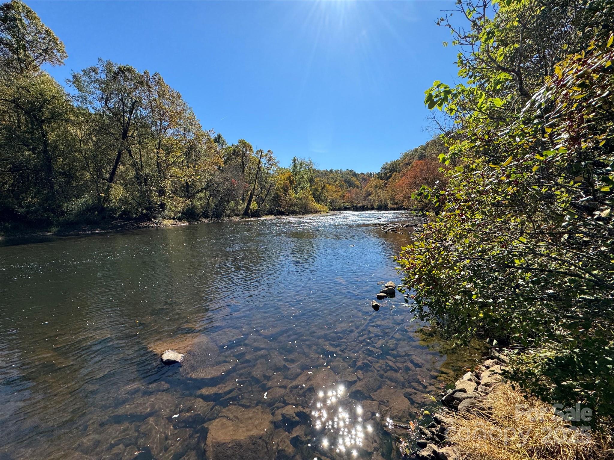 4136 Rose Creek Road Franklin, NC 28734 - Photo 22 of 37 a view of a lake with houses in the back