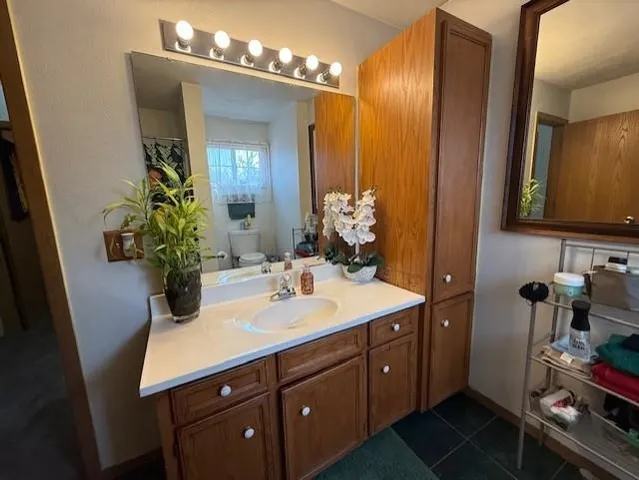 a bathroom with a sink double vanity and a mirror