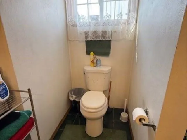 a bathroom with a toilet
