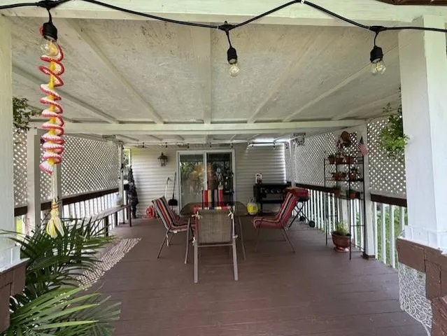 a view of a porch with furniture