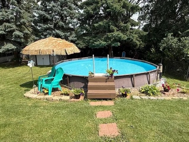 an outdoor space with furniture and umbrella