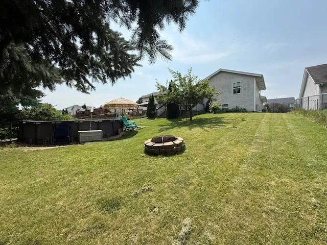a backyard of a house with lots of green space