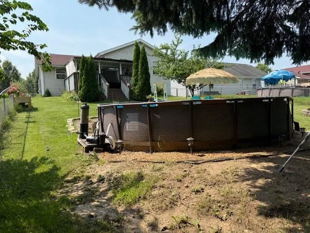 a view of a backyard of the house