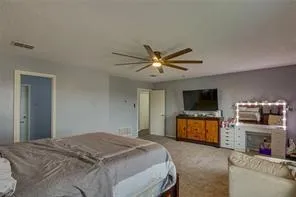 a bedroom with furniture and a window