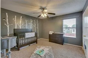 a bathroom with a double vanity sink mirror and shower