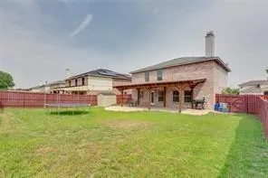 a view of a backyard of a house