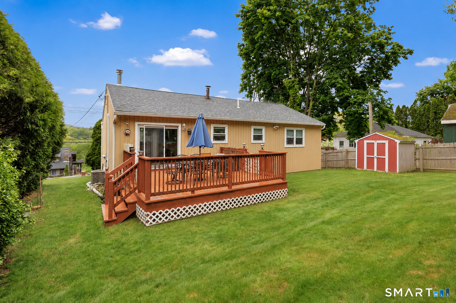 123 River Road Shelton, CT 06484 - Photo 24 of 27 a view of a house with a big yard potted plants and large tree