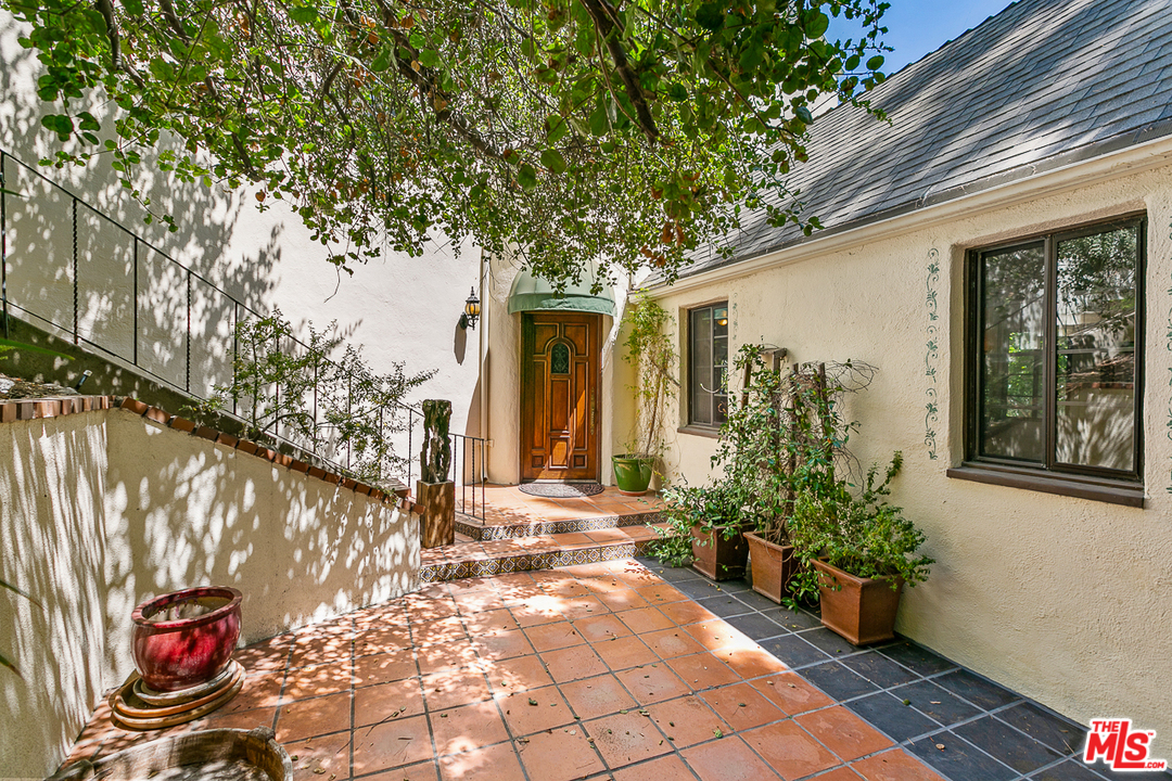 4458 Dundee Drive Los Angeles, CA 90027 - Photo 1 of 20 a front view of a house with garden