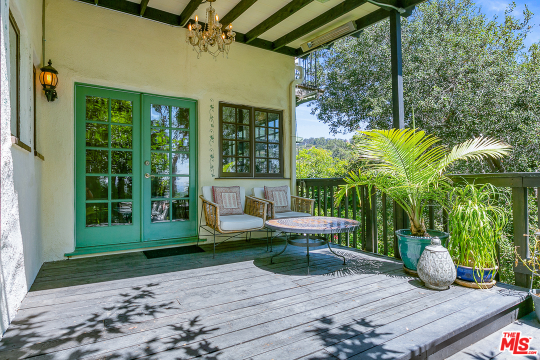 4458 Dundee Drive Los Angeles, CA 90027 - Photo 14 of 20 a view of a house with backyard sitting area and garden