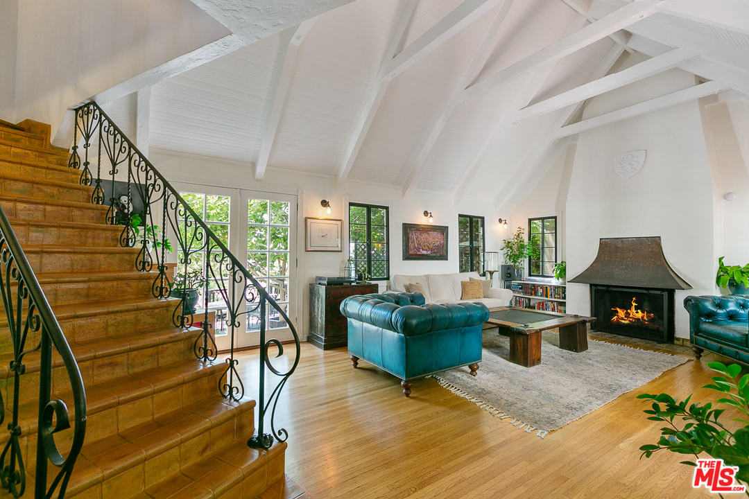 4458 Dundee Drive Los Angeles, CA 90027 - Photo 2 of 20 a living room with furniture and a fireplace