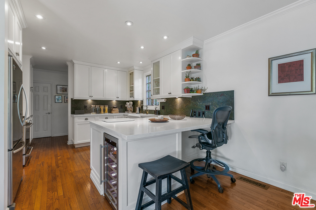 4458 Dundee Drive Los Angeles, CA 90027 - Photo 5 of 20 a kitchen with a sink cabinets and wooden floor