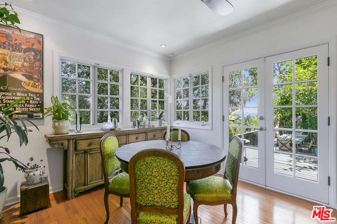 4458 Dundee Drive Los Angeles, CA 90027 - Photo 7 of 20 a view of a dining room with furniture and wooden floor