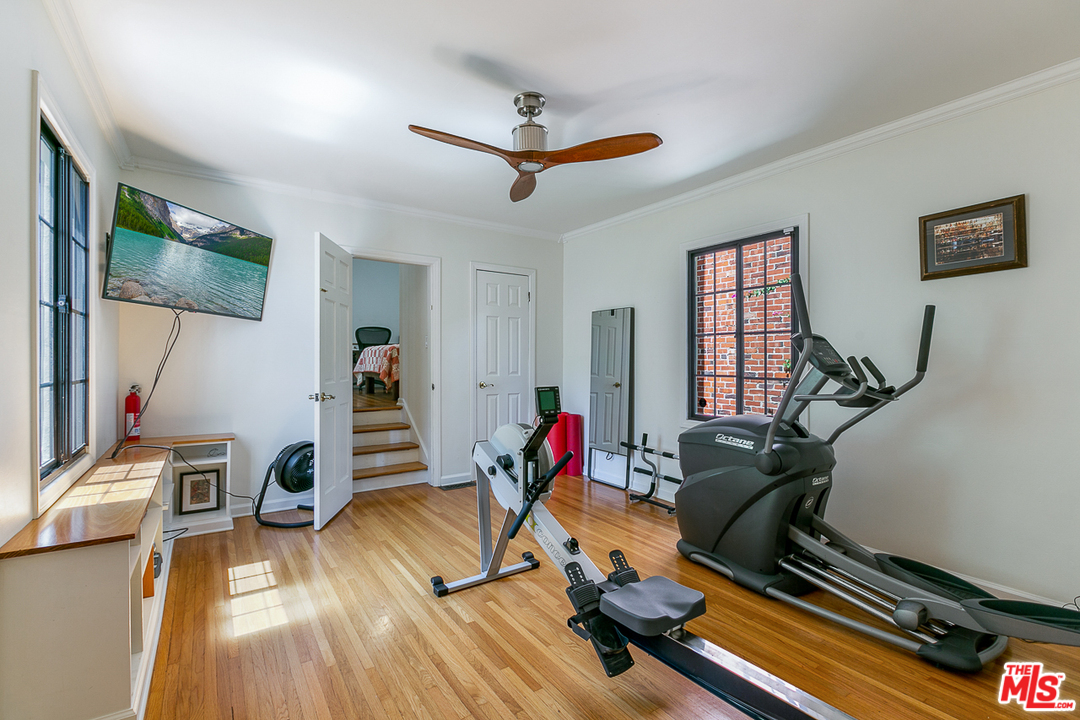 4458 Dundee Drive Los Angeles, CA 90027 - Photo 10 of 20 a living room with furniture gym equipment and wooden floor