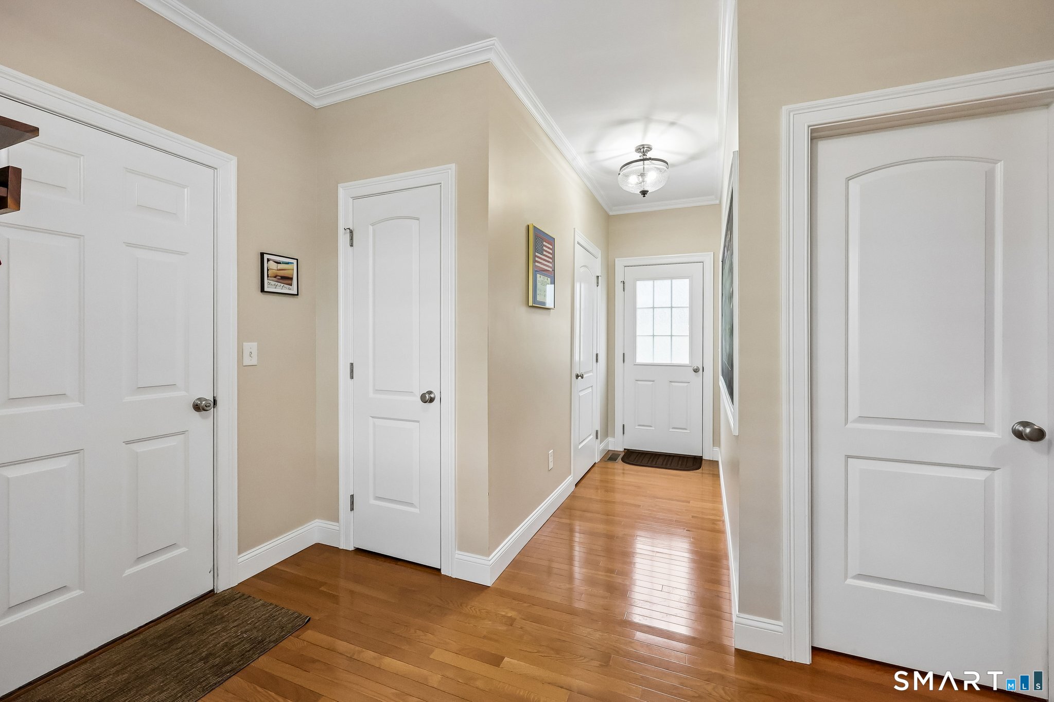 2 Gatehouse Road Granby, CT 06035 - Photo 18 of 40 a view of a hallway with wooden floor and a bathroom