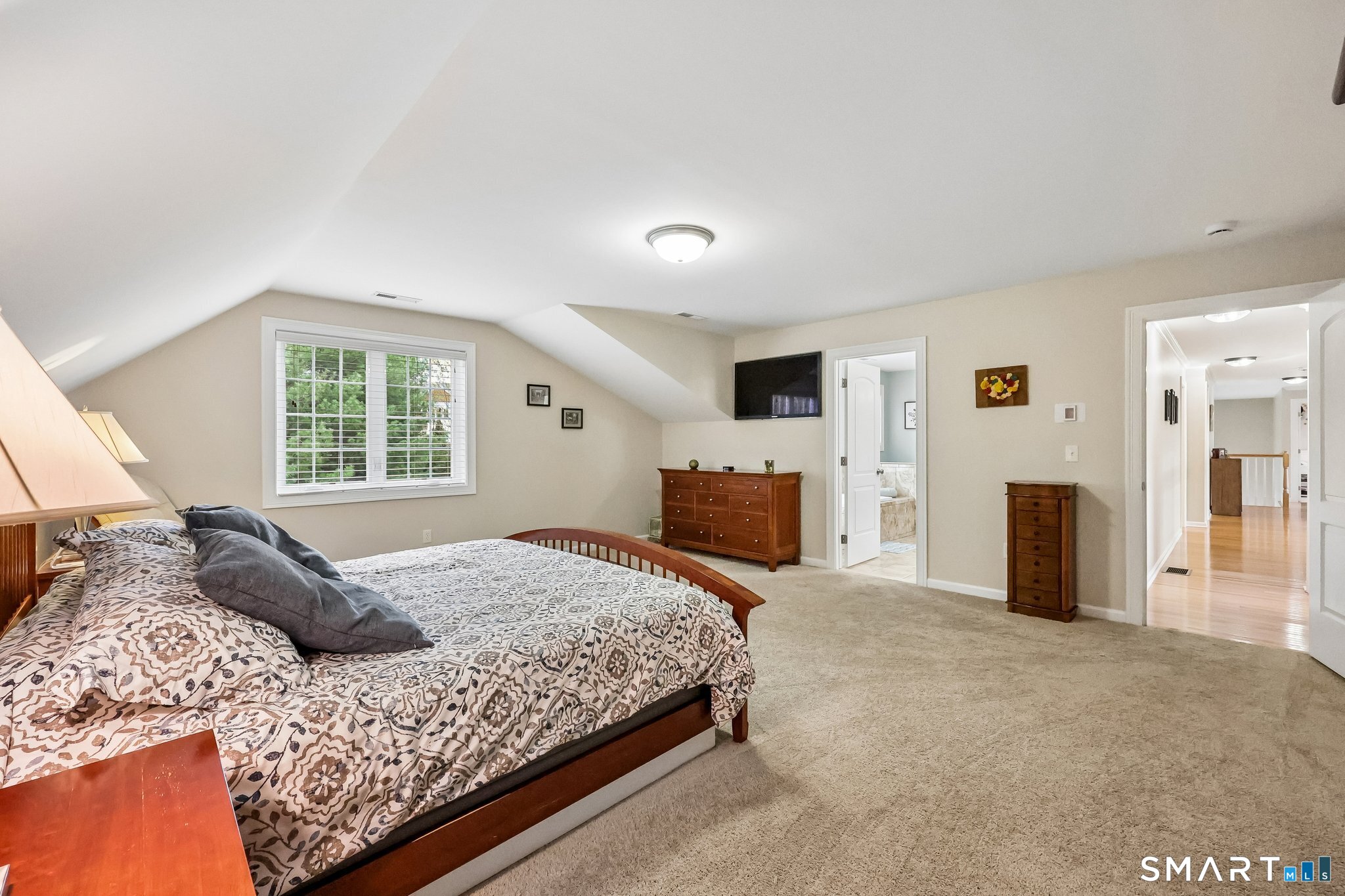 2 Gatehouse Road Granby, CT 06035 - Photo 28 of 40 a bedroom with a bed flat screen tv and a fireplace