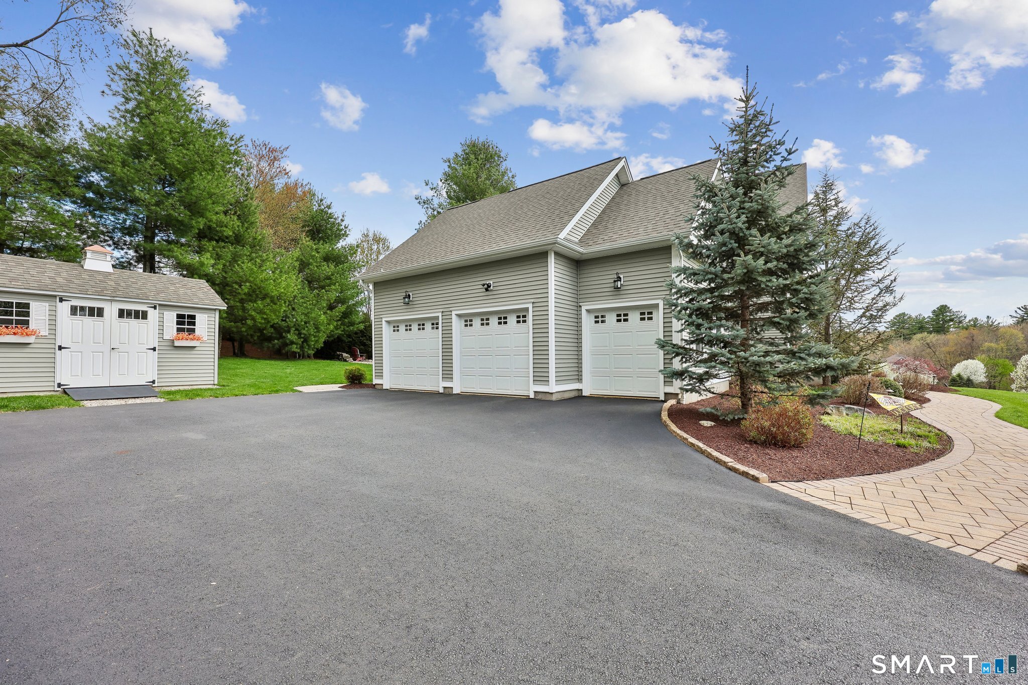 2 Gatehouse Road Granby, CT 06035 - Photo 36 of 40 a view of a house with a yard and garage