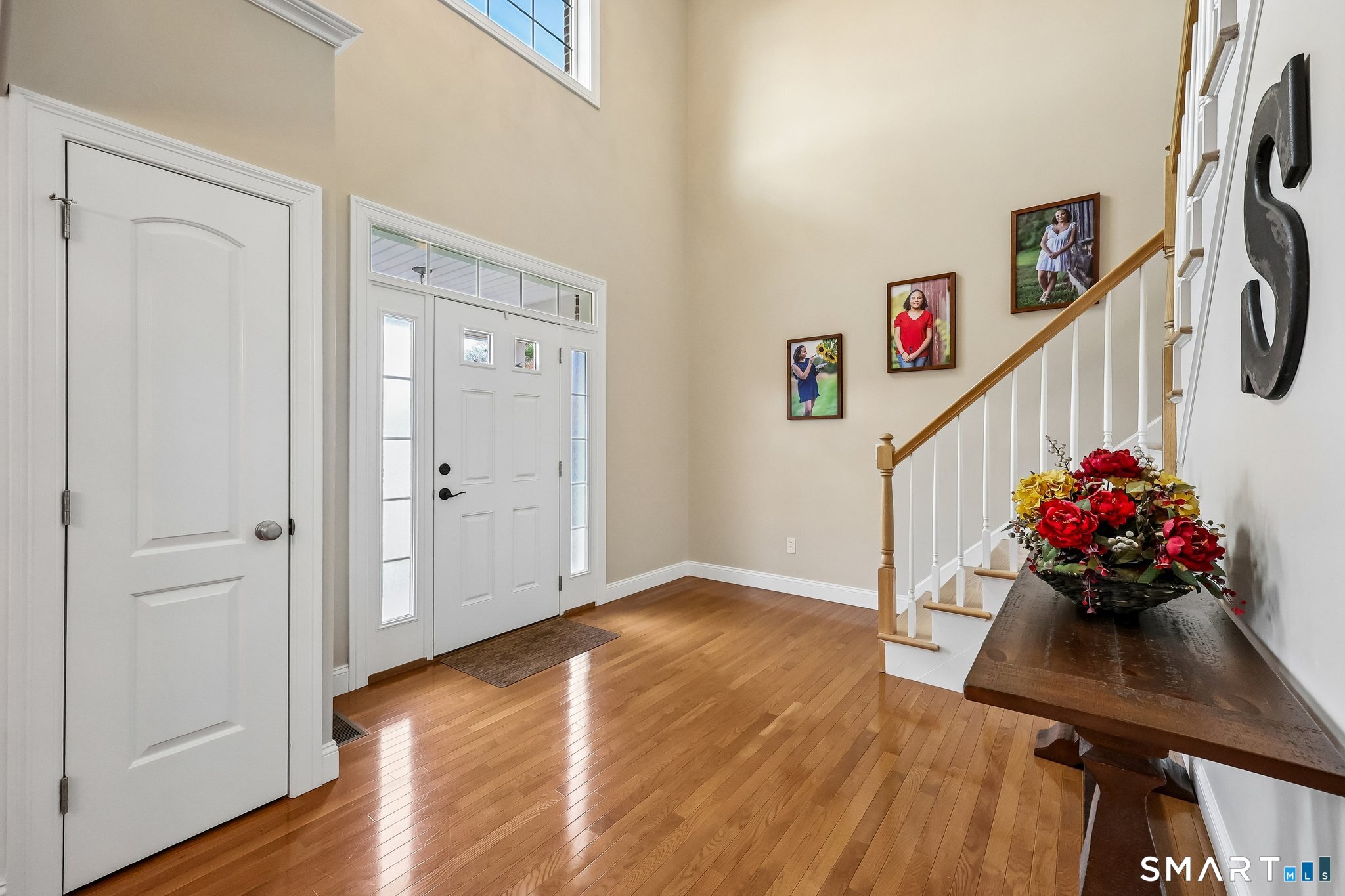 2 Gatehouse Road Granby, CT 06035 - Photo 8 of 40 a room with wooden floor and stairs