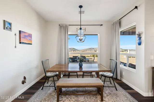 a bathroom with a tub shower and mirror