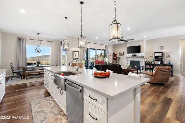 a kitchen with cabinets appliances and a counter space