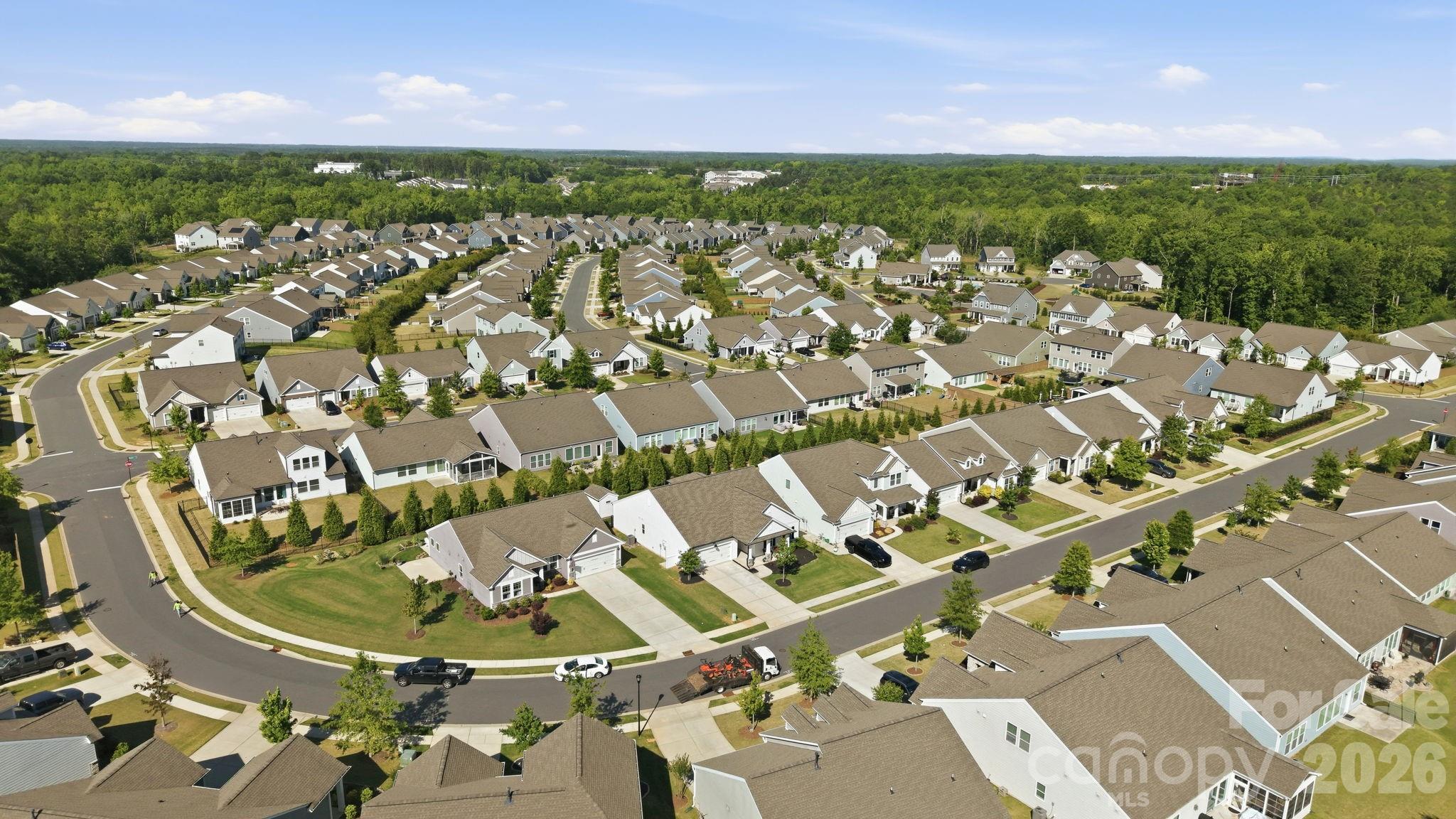 6038 Holland Street Fort Mill, SC 29707 - Photo 45 of 48 an aerial view of residential houses with outdoor space and trees