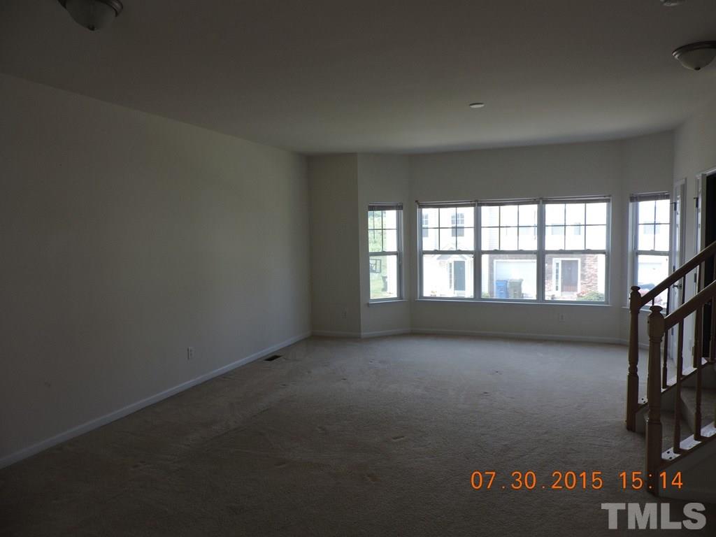 4904 Midstone Lane Raleigh, NC 27610 - Photo 8 of 11 an empty room with a window