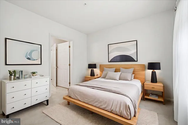 a bedroom with a bed and a dresser