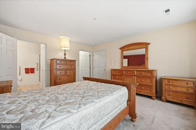 a bedroom with a bed and a television