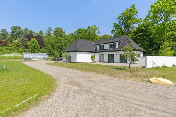 a front view of a house with a yard