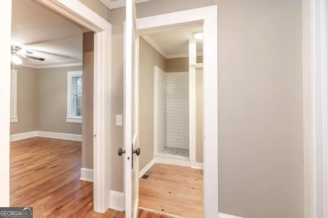 a view of a bathroom from a hallway