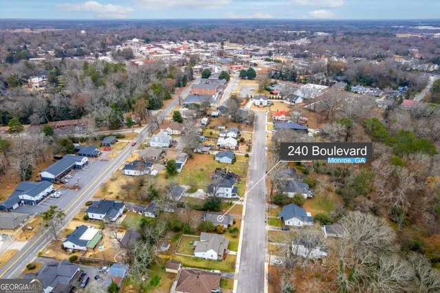 an aerial view of residential building with an outdoor space