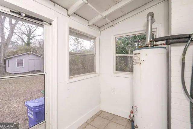 a bathroom with a toilet a sink and a window