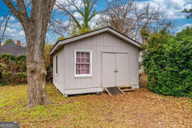 a house with trees in the background