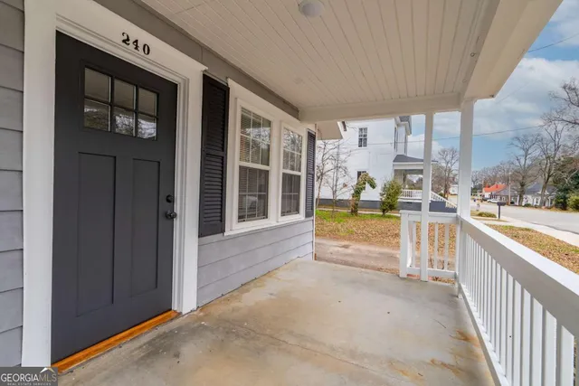 a view of spacious bathroom with a tub and shower