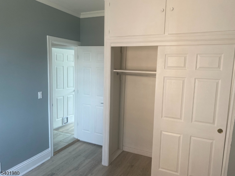 14 Jackson Street, Unit 9 Passaic, NJ 07055 - Photo 4 of 11 a view of an empty room with wooden floor