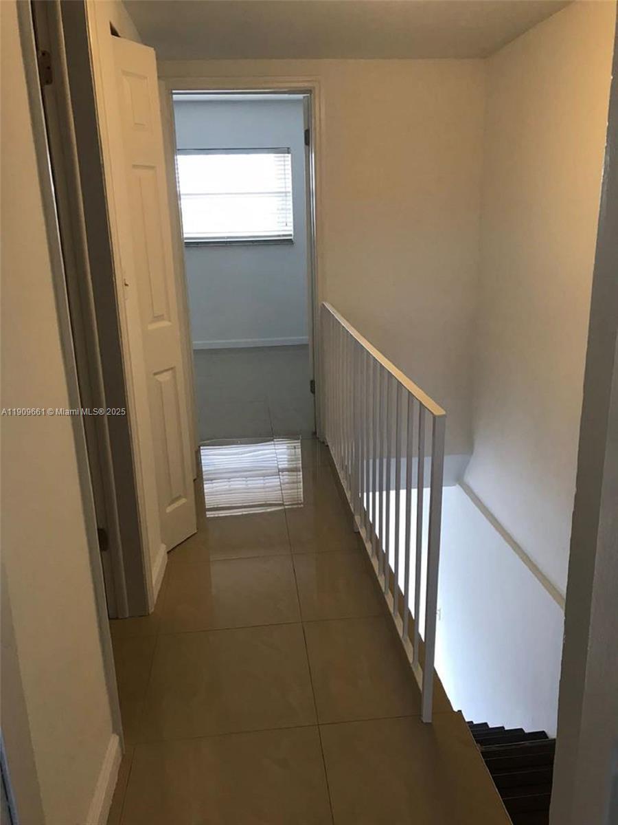1100 West 35th Street, Unit 27 Hialeah, FL 33012 - Photo 11 of 24 a view of a hallway