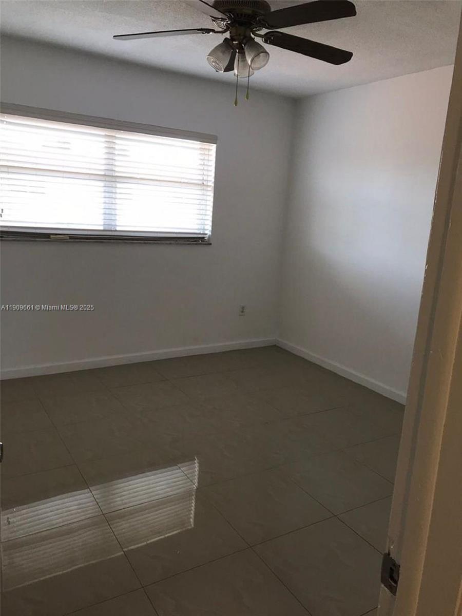1100 West 35th Street, Unit 27 Hialeah, FL 33012 - Photo 16 of 24 a view of room and window