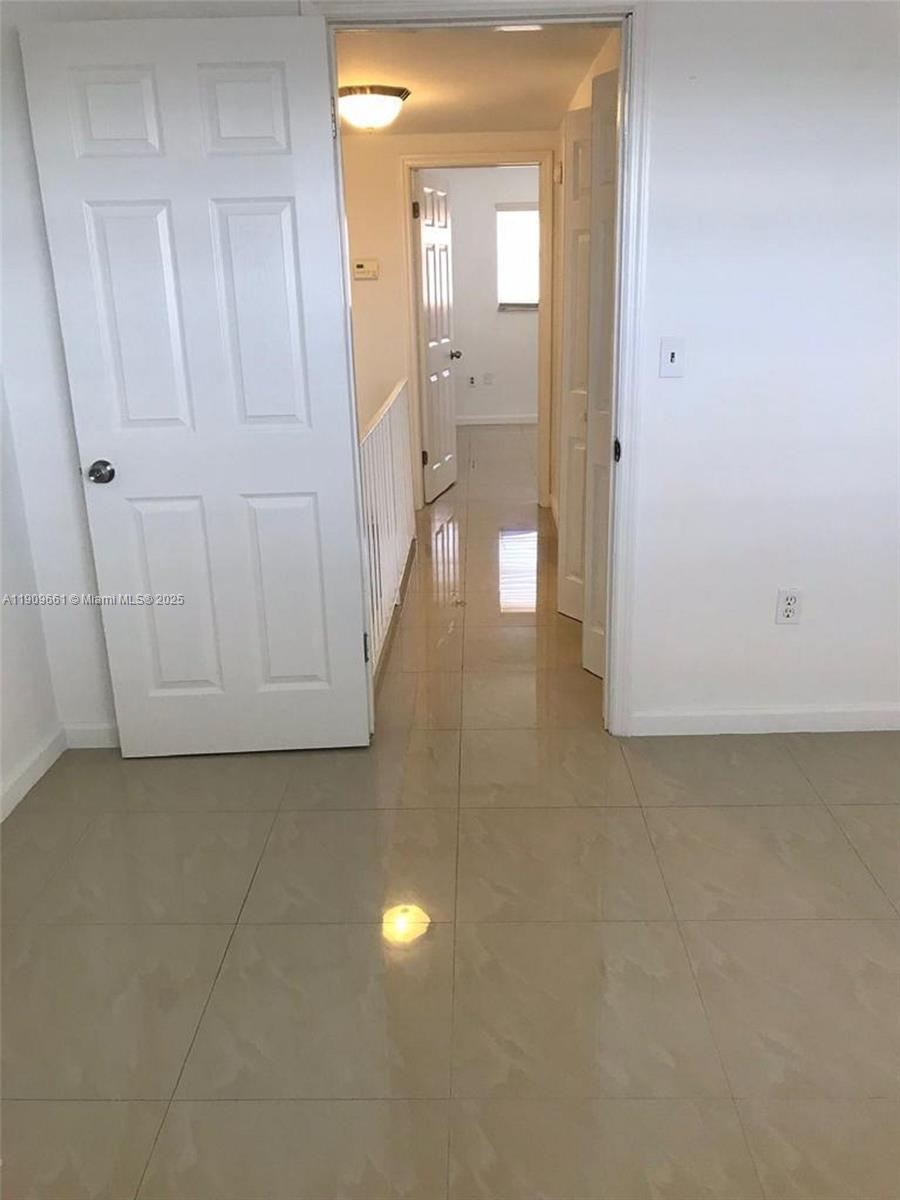 1100 West 35th Street, Unit 27 Hialeah, FL 33012 - Photo 21 of 24 a view of a bathroom with mirror