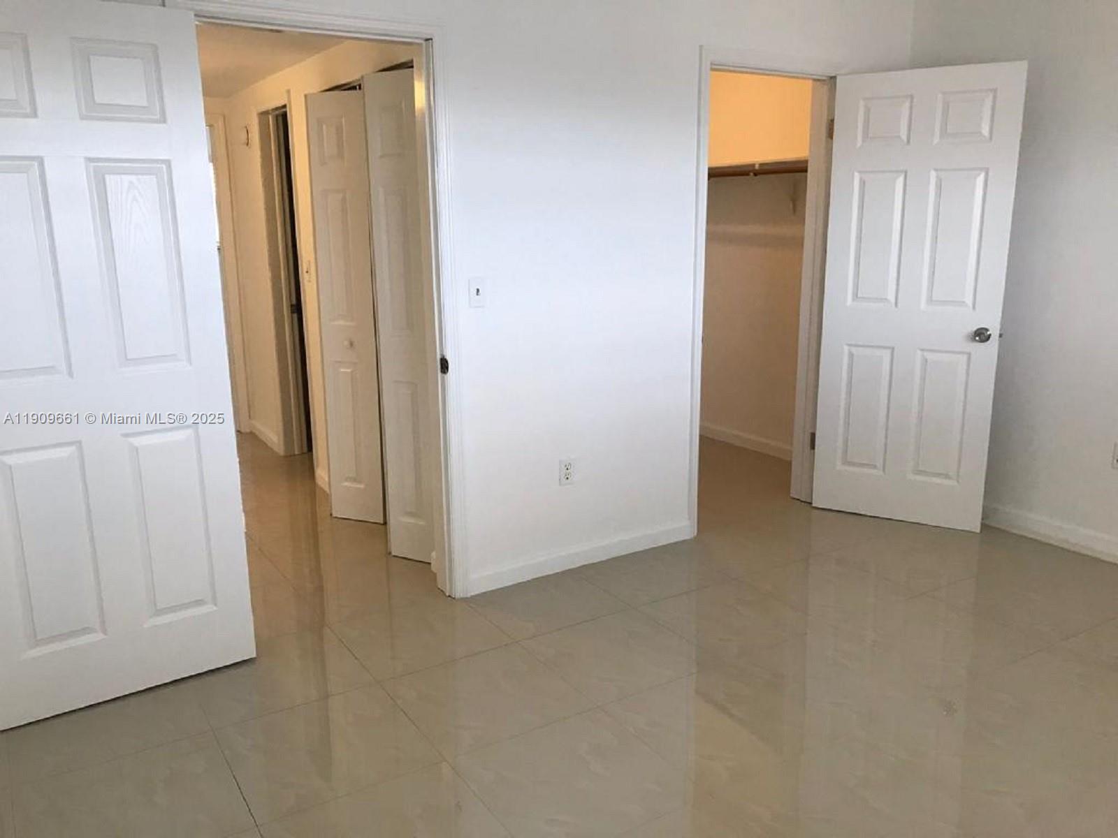 1100 West 35th Street, Unit 27 Hialeah, FL 33012 - Photo 23 of 24 an empty room with closet area